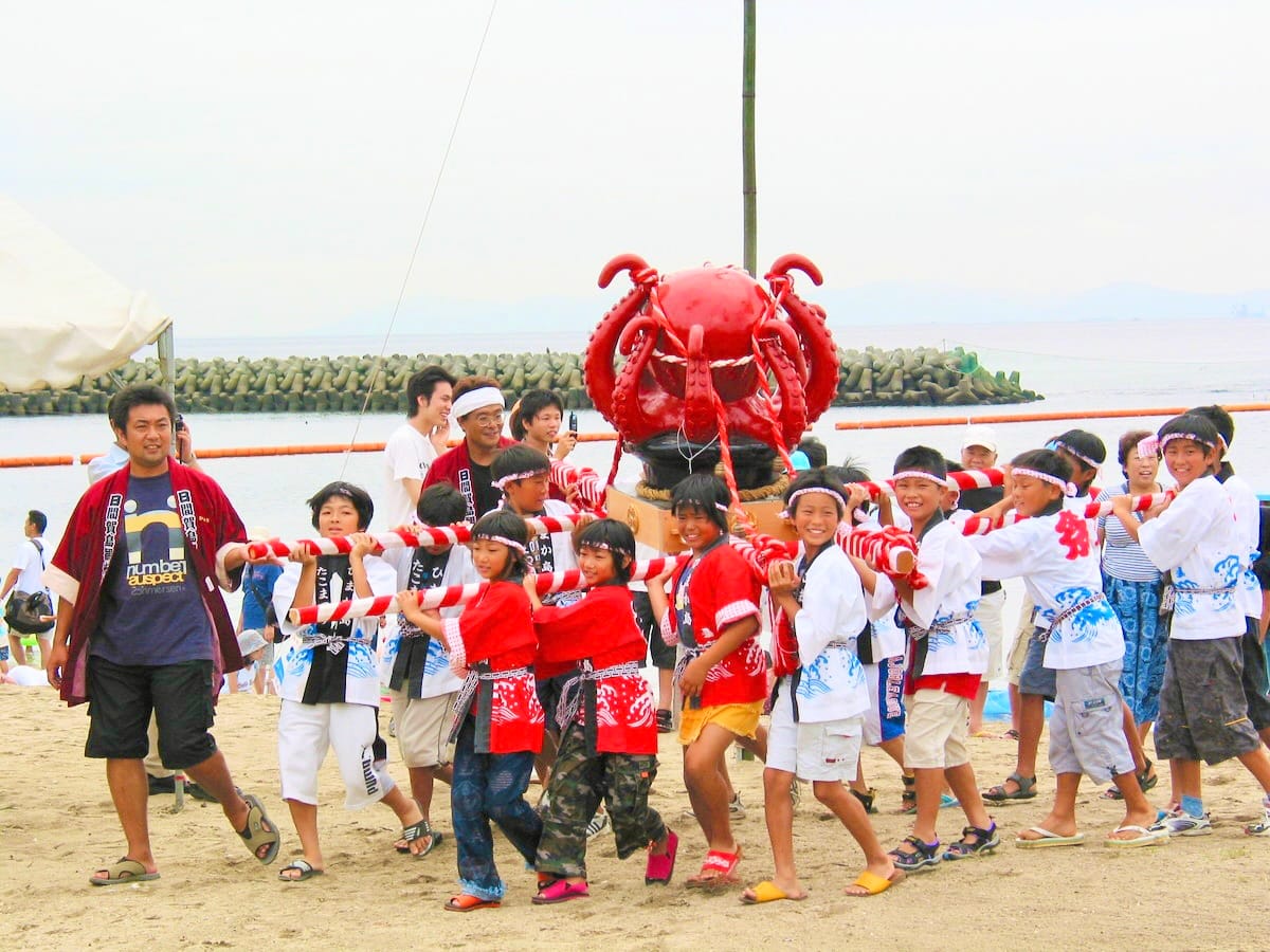 Kids carrying Octopus shrines during the annual Takomikoshi Parade on Hikajima Island