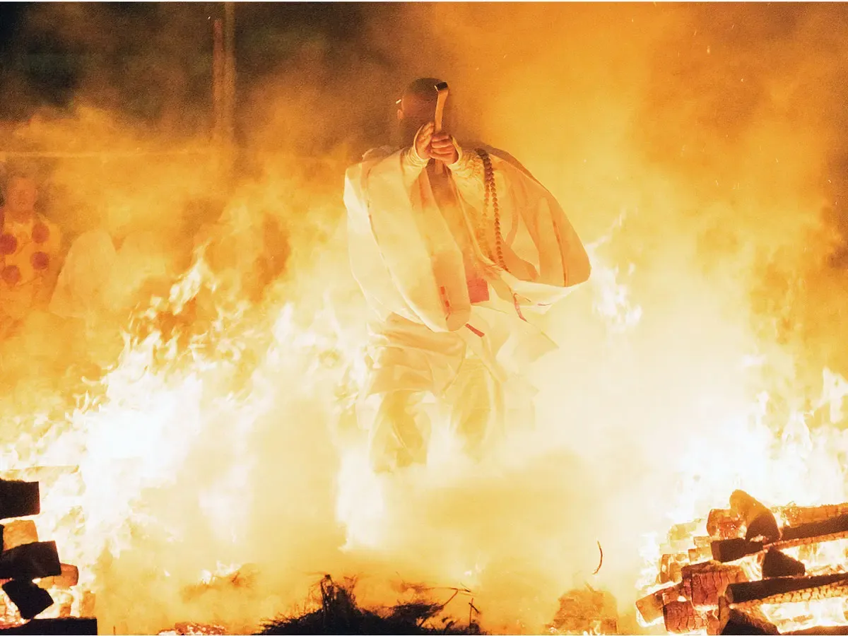 Participant cleanse their souls by walking through the fire