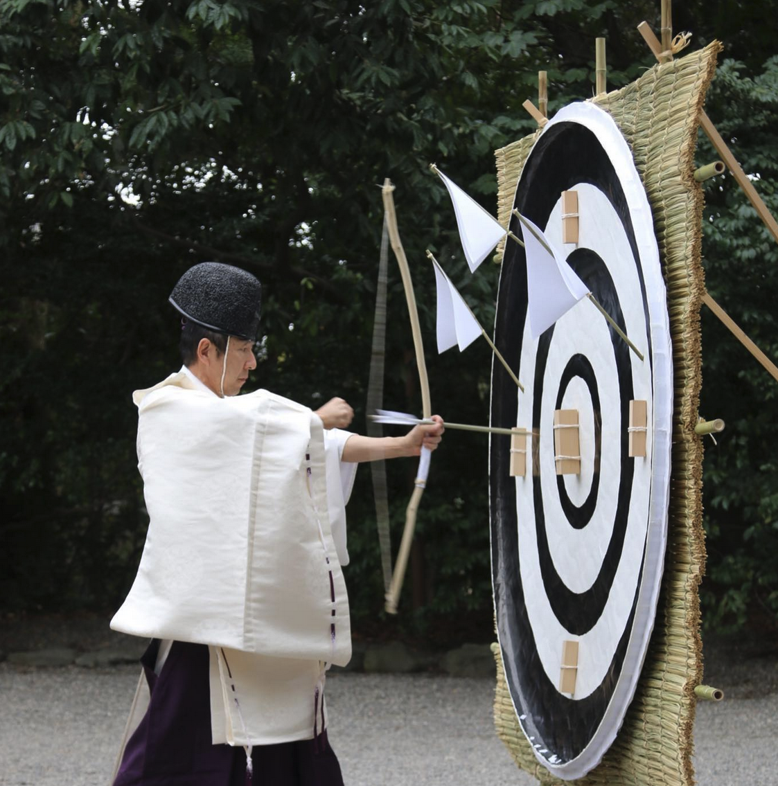 A Shinto priest inspects an arrow during the Hōsha Shinji at Atsuta Shrine 